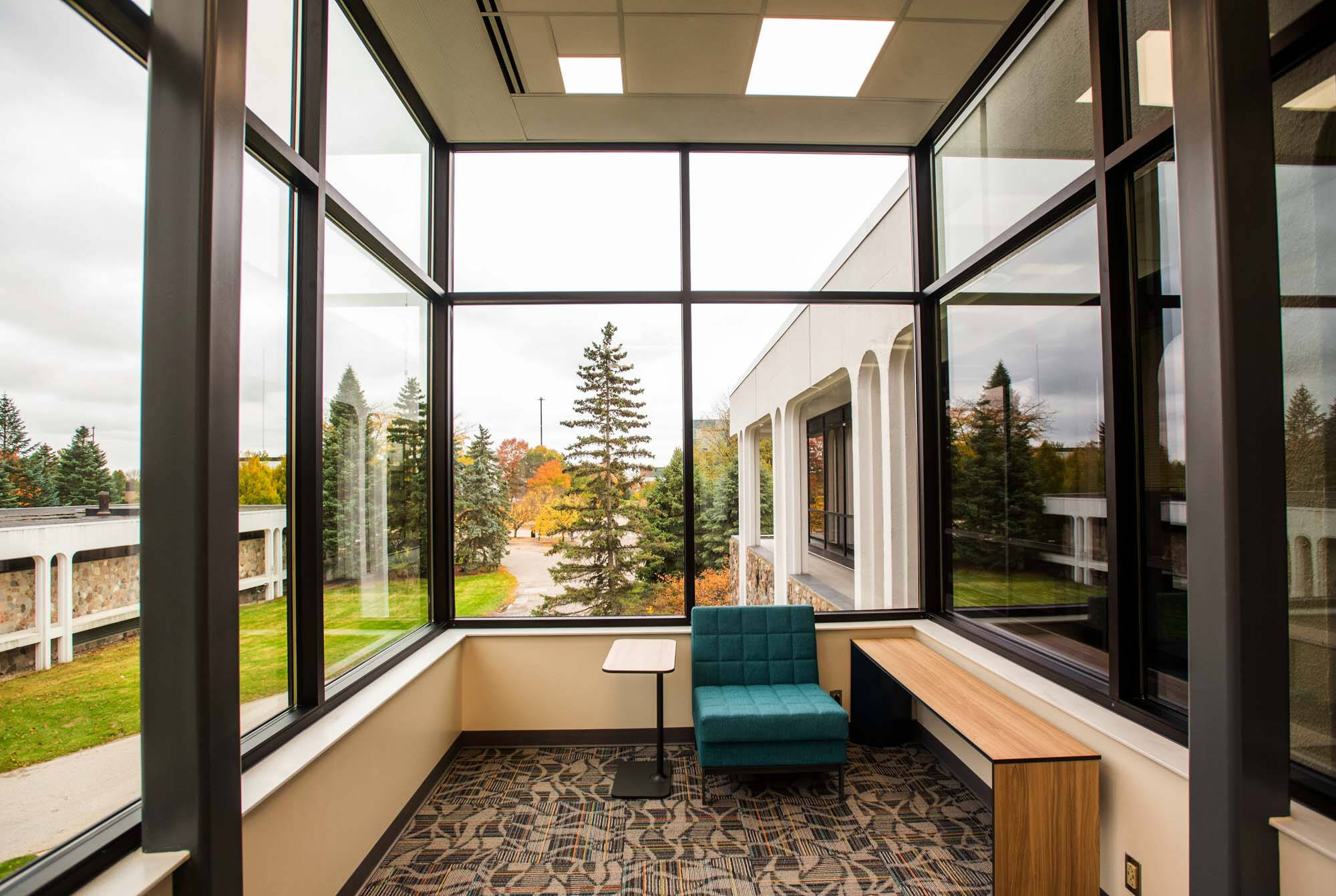 Interior seating area with windows at Lake Huron Hall.